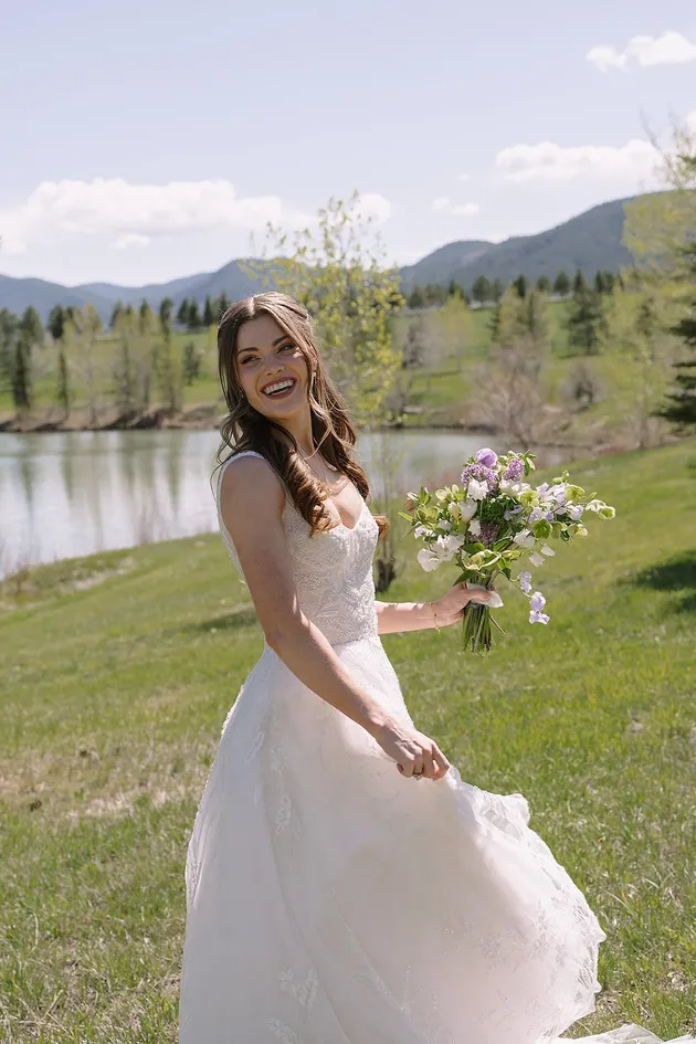 Bride bouquet with lake and mountain backdrop